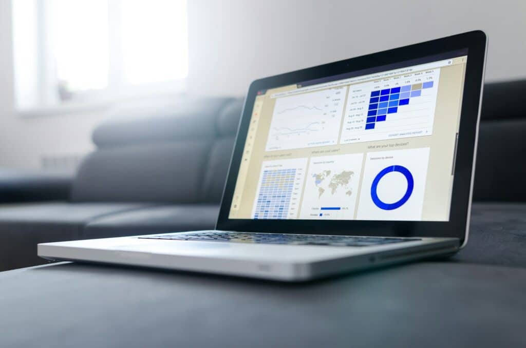 Laptop with SEO analytics and traffic dashboard.