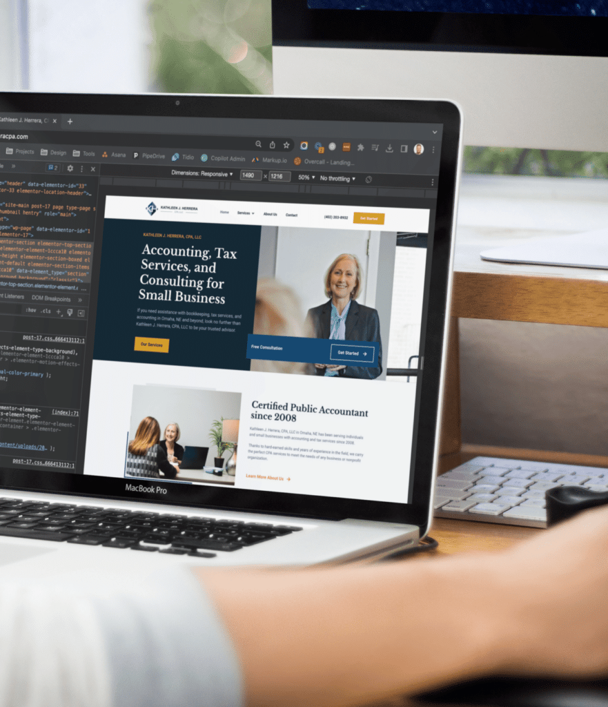 Web Designer Coding A Small Business Website.