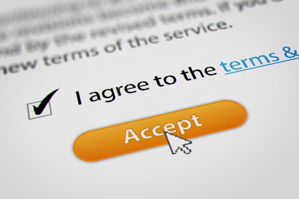 Image of a website user accepting terms and conditions and online privacy policy.