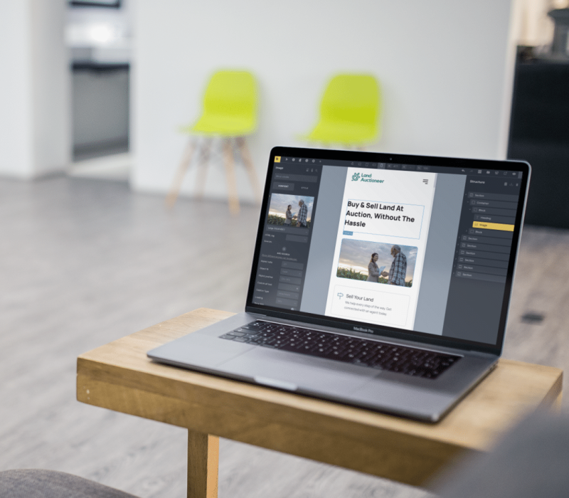 Omaha Website Design And Development Agency Working On Laptop In A Modern Office.